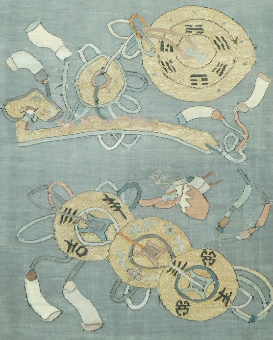 An early 20th century framed Chinese Kesi panel, woven with large amulets, eight trigrams and a Ruyi sceptre and good luck symbols, often given to a new born baby. 24cm wide x 30cm high. Condition - some very light fadin